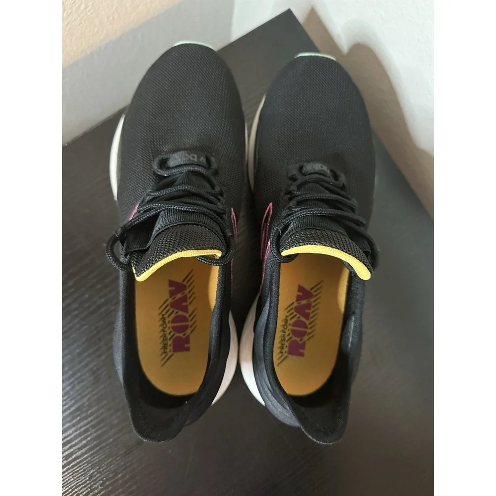 New Balance Black Athletic Sneakers with Pink and Yellow Accents